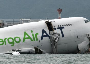 Cargo plane skids off Hong Kong airport runway into sea